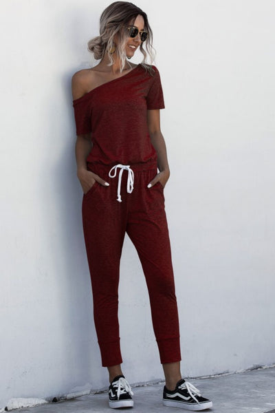 Asymmetrical Neck Tied Jumpsuit with Pockets - SHE BADDY© ONLINE WOMEN FASHION & CLOTHING STORE